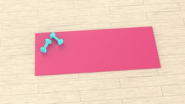 木製の床に2つの小さなダンベルとゴムフィットネスマット — ストック動画