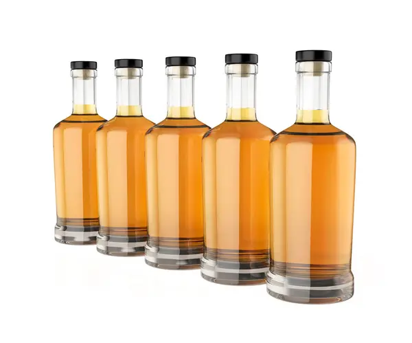 Reihe Mit Fünf Whisky Flaschen Auf Weißem Hintergrund lizenzfreie Stockbilder