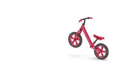 Boş bir kırmızı denge bisikleti bir tekerlek üzerinde soldan sağa doğru sürüyordu.