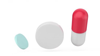 beyaz arkaplanda haplar ve kapsül