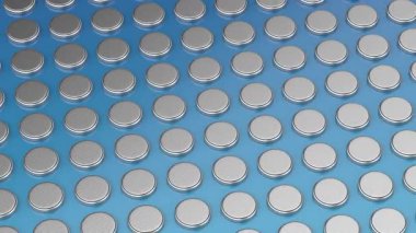 Parlak mavi arkaplanda bir sürü düğme pili