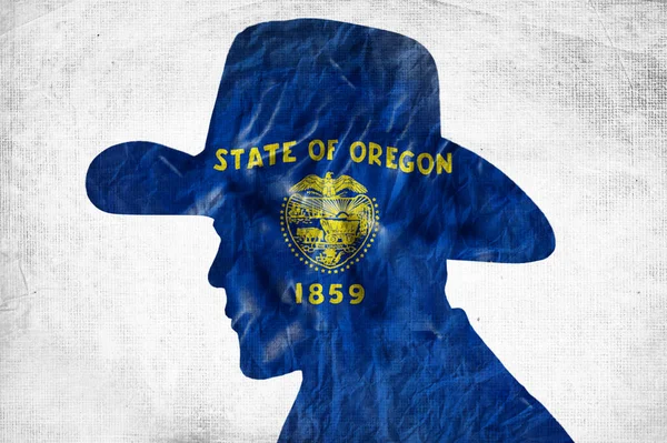 Kowbojska Sylwetka Flagą Oregonu Pomarszczonym Papierowym Tle — Zdjęcie stockowe
