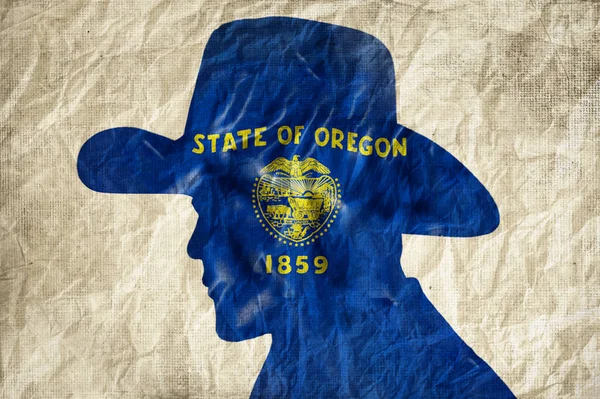 Kowbojska Sylwetka Flagą Oregonu Pomarszczonym Papierowym Tle — Zdjęcie stockowe