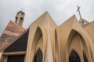 Exterior with arches, crosses, decorative walls of Catholics church in Abuja, church is known as The National Christian Centre (previously known as the National Ecumenical Centre or as the National Church of Nigeria) is a Christian place of worship