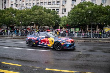 Racing red-bull sport vehicle on city streets, driven by Elias Hountondji, German drifting specialist and racing driver, at the Red-Bull exhibition in Belgrade, Serbia