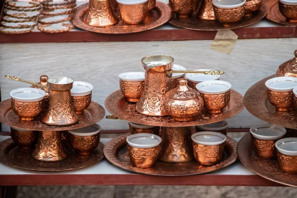 Turkish delight cups, pots, tea kettles and souvenirs are made of copper. Mostar city in Bosnia and Herzegovina. Local traditional handicraft production for tea and coffee lovers