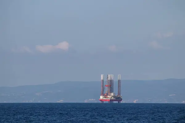 Oil refinery platform at the open sea, producing black gold, Aegean Sea, Greece