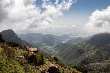 Amba Alaji in Ethiopia boasts a stunning landscape with majestic mountains, dramatic cliffs, and lush greenery, offering breathtaking vistas and a serene escape into nature's raw beauty. Peak of mountain has an elevation of 3,420 meters (11,220 feet) clipart