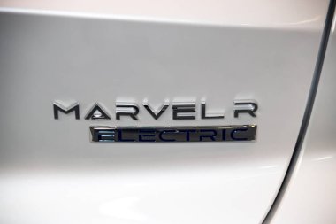 The rear badge and back lights of the White MG Marvel R showcase the car's modern design and distinctive branding with sleek, illuminated taillights clipart