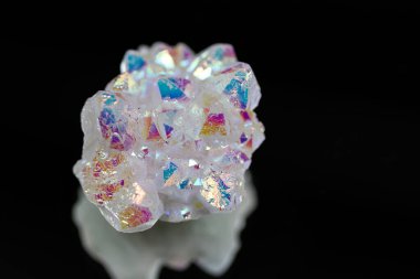 A rainbow aura quartz crystal cluster radiates vibrant, iridescent hues, combining natural beauty with mystical energy and gemstone brilliance, isolated in studio clipart