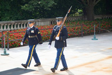 WASHINGTON DC, USA - SEP 5, 2022: Change of the guard near the Unknown Soldier tomb at the Arlington national cemetery. United States military cemetery is the most sacred national landmark.