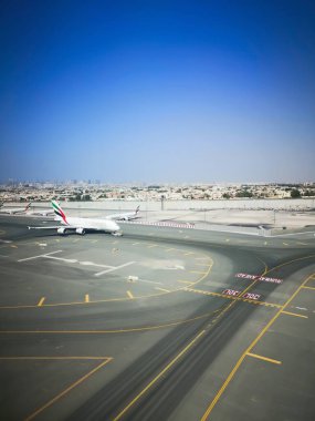 Dubai - October 24:  Planes preparing for take off at Dubai Airport on October 24, 2022 in Dubai, U.A.E. Dubai airport is home port for Emirates Airlines and one of the biggest world hubs.