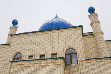 Beautiful Muslim mosque in blue skies and grass. High qualiti photo.