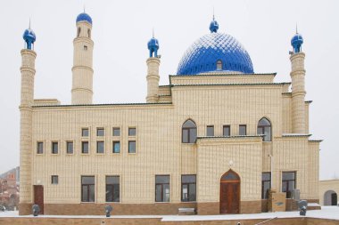 Beautiful Muslim mosque in blue skies and grass. High qualiti photo.