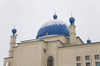 Beautiful Muslim mosque in blue skies and grass. High qualiti photo.