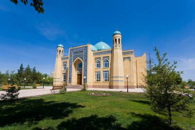 Beautiful Muslim mosque in blue skies and grass. High qualiti photo.