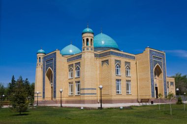 Beautiful Muslim mosque in blue skies and grass. High qualiti photo.