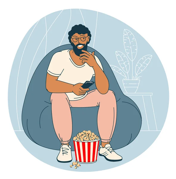 Uomo Con Popcorn Sta Guardando Mentre Seduto Una Sedia Visualizzazione — Vettoriale Stock