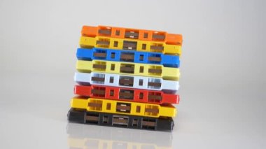 Stacked colorful audio cassettes rotating on a taple