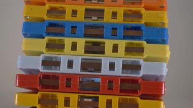 Stacked colorful audio cassettes rotating on a taple