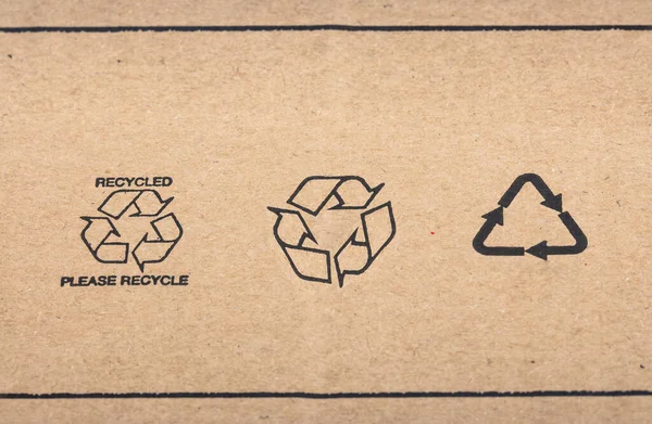 Recycle signs printed on cardboard box in Detail.