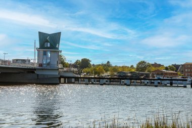 Modern bascule bridge spanning the Schlei river, with control tower in the city center of Kappeln in germany clipart