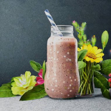 Decorative Smoothie of mixed fruits with herbs