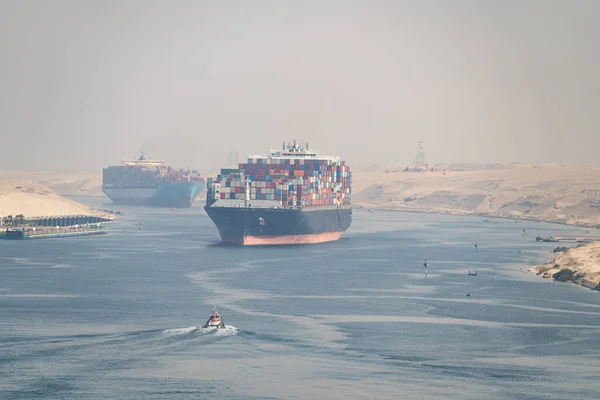 stock image Many cargo ships navigate through Suez Canal. Shipping canal in Egypt. Concept of transportation and logistics.