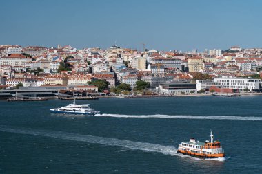 Water transportation in Lisboa. Ferry and boat crossing Tagus river. Vacation, travel concept