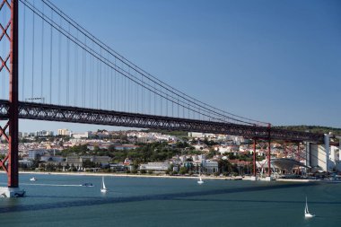 going under suspension bridge tagus river lisbon portugal. Travel, vacation concept