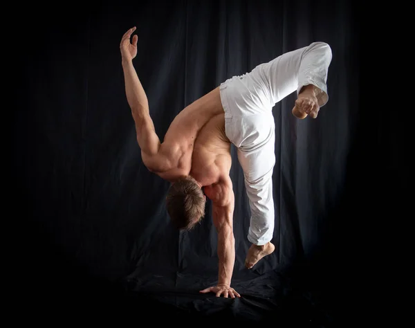 Circus Artist Keeps Balance One Hand Isolated Black Background Concept Stock Photo
