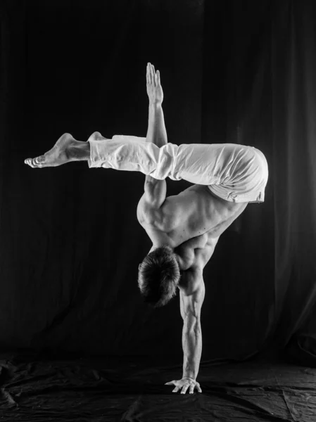 Circus Artist Keeps Balance One Hand Isolated Black Background Concept Stock Picture
