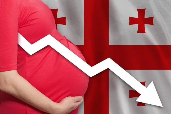 Pregnant woman on Georgian flag background. Falling fertility rate in Georgia