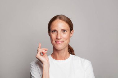 Attractive mature woman on white background portrait