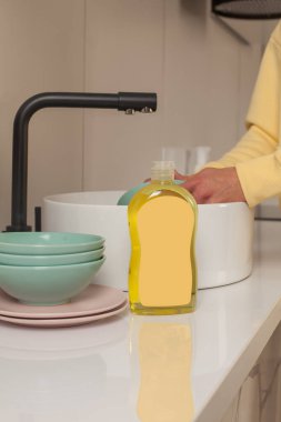 Bottle of dishwashing liquid with blank label