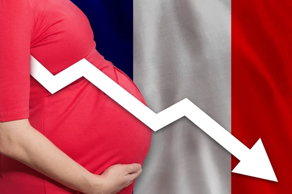 French pregnant woman on French flag background. Falling fertility rate in France