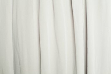 Beyaz ipek pürüzsüz arka plan. Kumaş saten dokusu.