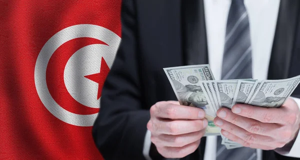 Mãos Segurando Dinheiro Dólar Bandeira Tunísia — Fotografia de Stock