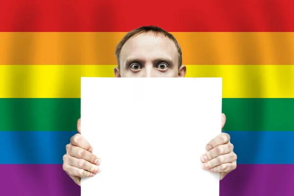Surprised Man Holding Blank Sign Paper Baclground Lgbt Flag — Stock Photo, Image