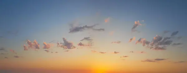Idyllic atmosphere sunset sky horizon landscape. Panoramic golden sky with cloud and sunlight