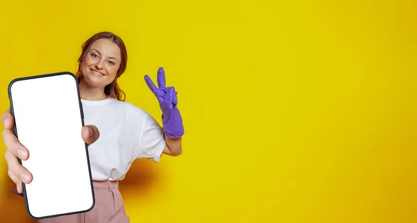 Attractive Woman Cleaning Gloves Holding Smartphone Empty White Screen Display Stock Image