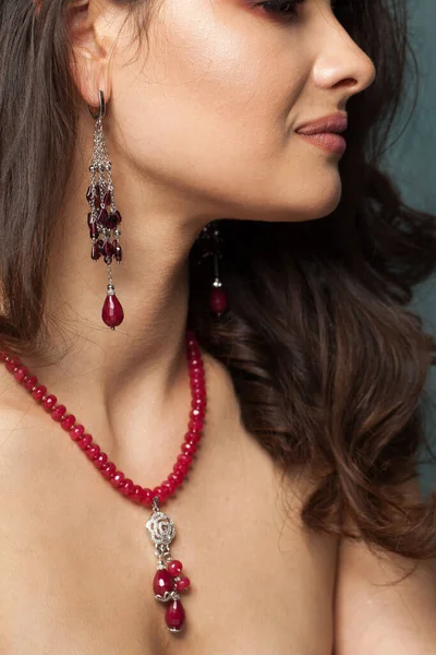 Fashionable jewelry model. Woman with bijou close up