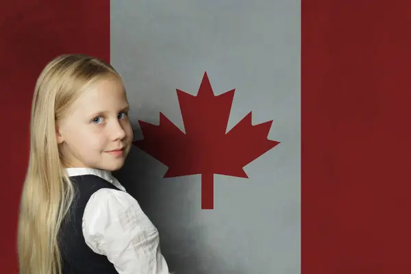 Cute young child girl on Canadian flag background. Education and study language in Canada concept