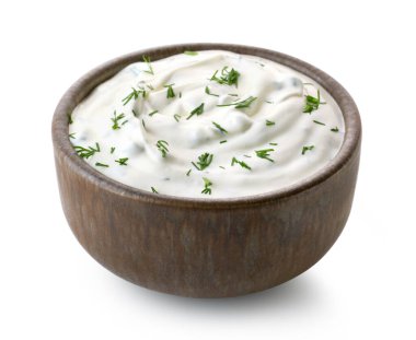 Brown ceramic bowl of fresh sour cream dip sauce with herbs isolated on white background clipart