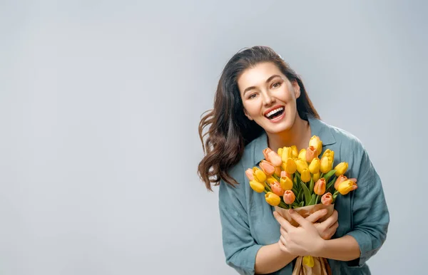 Beautiful Young Woman Yellow Flowers Hands Grey Wall Background — Stock Photo, Image