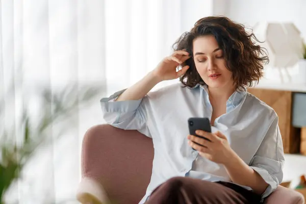 Happy Casual Beautiful Woman Using Phone Sitting Armchair Home Stock Picture