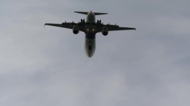 PHUKET, THAILAND - NOVEMBER 27, 2019: Boeing 737, 9M-MLK of Malaysia Airlines flies overhead at Phuket airport. Airliner landing. Tourism and travel concept.