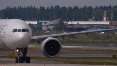 MOSCOW, RUSSIAN FEDERATION - JULY 29, 2021: Passenger plane Boeing 777 of Nordwind airlines taxiing at Sheremetyevo airport, Moscow SVO. Airplane on the airfield. Tourism and travel concept.