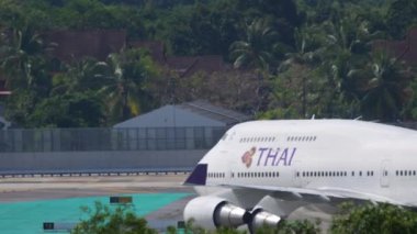 PHUKET, THAILAND - NOVEMBER 27, 2019: Boeing 747 of Thai Airways taxiing to the terminal after landing at Phuket Airport. Tourism and travel concept