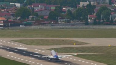 SOCHI, RUSSIA - AUGUST 03, 2022: Long shot rear view of Boeing 737 of Smartavia taking off at Sochi airport. Smartavia Russian airline. Tourism and travel concept